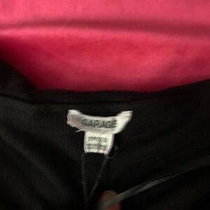 Garage off the shoulder top
Small unoticeable hole